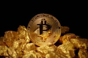 Golden Bitcoin Coin and mound of gold.