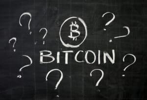 word bitcoin surrounded by question marks
