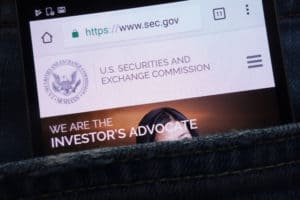 KONSKIE, POLAND - JUNE 02, 2018: U.S. Securities and Exchange Commission website displayed on smartphone hidden in jeans pocket. Source; shutterstock.com