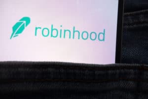 KONSKIE, POLAND - JUNE 12, 2018: Robinhood logo displayed on smartphone hidden in jeans pocket. Source: shutterstock.com