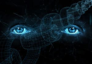Close up of human eyes on digital computer blockchain chain background. Source: shutterstock.com