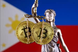 Symbol of law and justice, physical version of Bitcoin and Philippines Flag. Prohibition of cryptocurrencies, regulations, restrictions or security, protection, privacy. Source: shutterstock.com