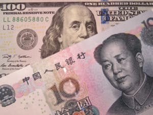 Chinese yuan and US dollar. Concept for trade war between China and the U.S. Source: shutterstock.com
