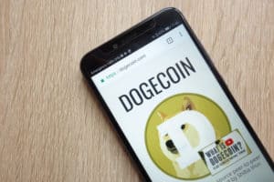 KONSKIE, POLAND - JULY 01, 2018 Dogecoin (DOGE) cryptocurrency website displayed on Huawei Y6 2018 smartphone. Source; shutterstock.com