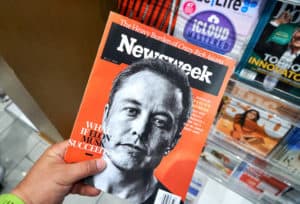 MIAMI, USA - AUGUST 23, 2018 Newsweek magazine with Elon Musk on main page in a hand. Newsweek is an American famous and popular weekly magazine