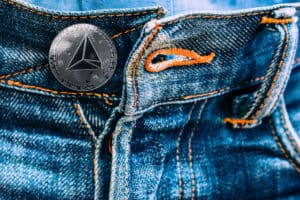 The coin tron instead of buttons on jeans. new fashion.