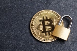 bitcoin security concept. Gold coin with padlock