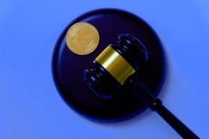 Law or auction concept with gavel and replica of gold bitcoin.Bitcoin cryptocurrency Internet business technology theme. - Image
