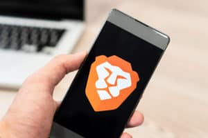 Brave Browser logo displayed on smartphone and computer laptop in background. Slovenia 13.02.2019 - Image