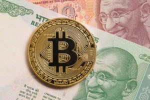 Golden bitcoin and indian rupee money - ImageGolden bitcoin and indian rupee money - Image