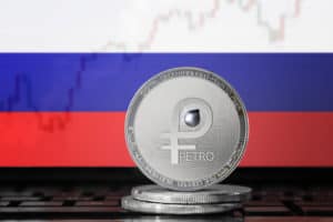 PETRO (PTR) cryptocurrency; coin el petro on the background of the flag of Russia (Russian federation); national Venezuela cryptocurrency - Image